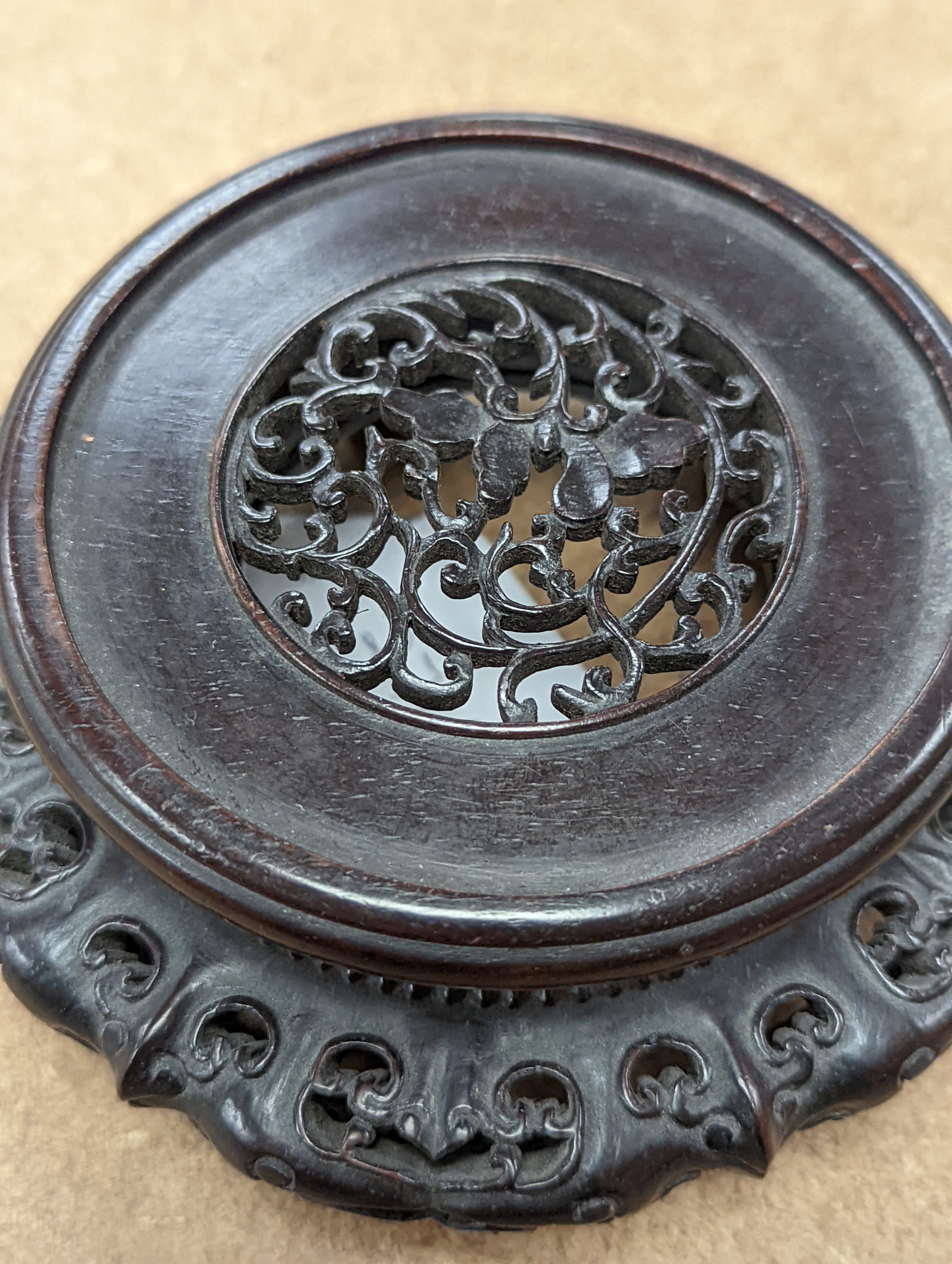 A fine 19th century Chinese hardwood stand, 11.4cm diameter